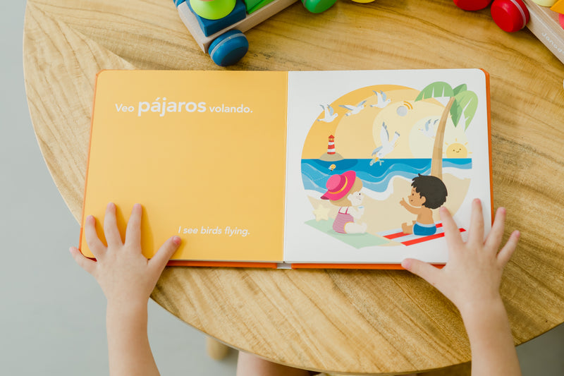 This bilingual baby book, Visiting- Visitando La Playa, is perfect for babies and toddlers as they learn to play a sound book and enjoy it's fun sounds and images while also learning Spanish!